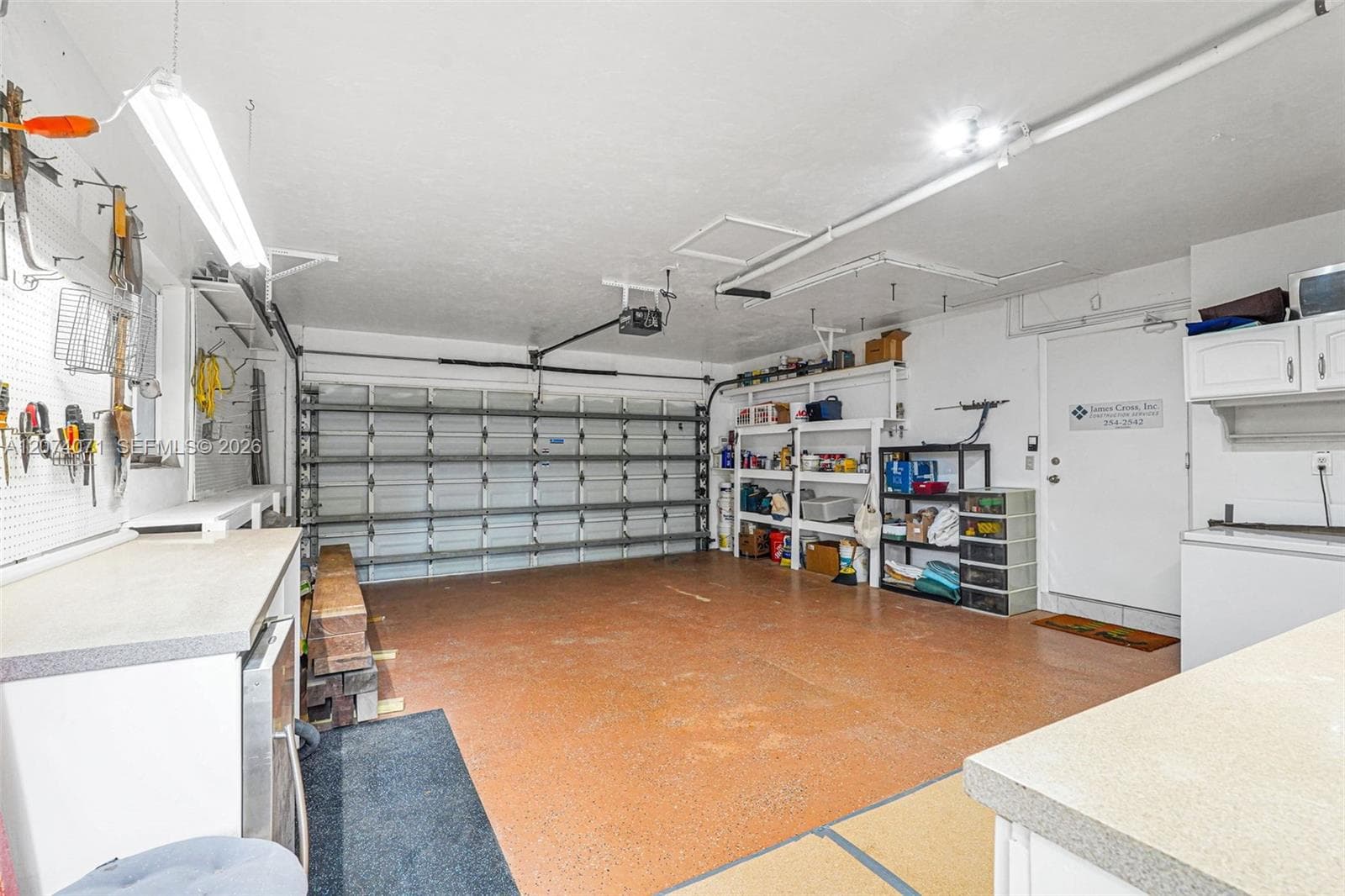 Spacious two-car garage with additional storage and workspace.