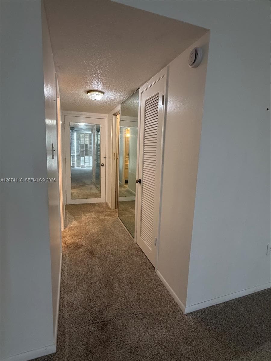 Master Bedroom access to bath and two walk-in closets, plus additional exit.