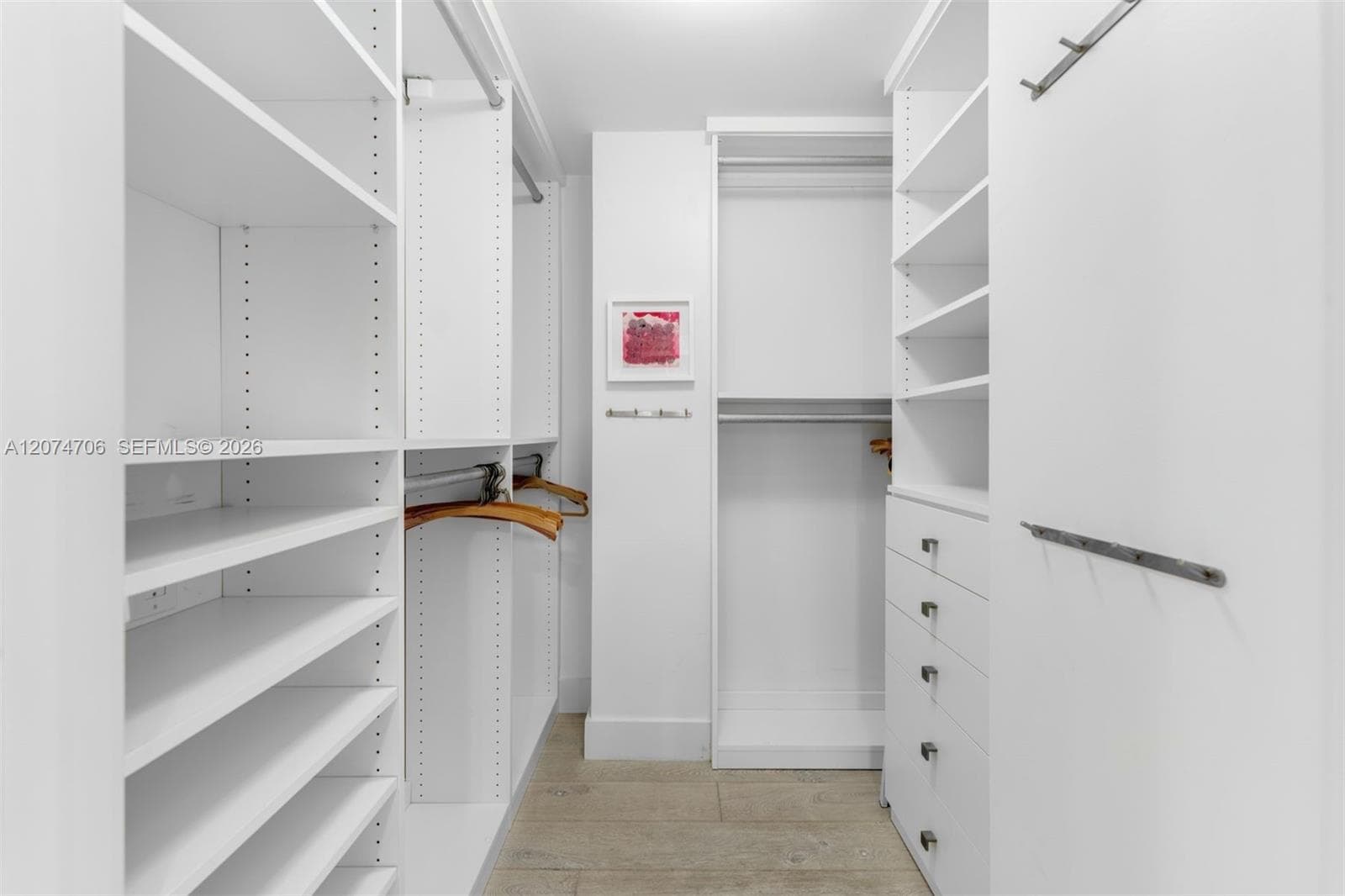 1 of 2 Primary walk in closet