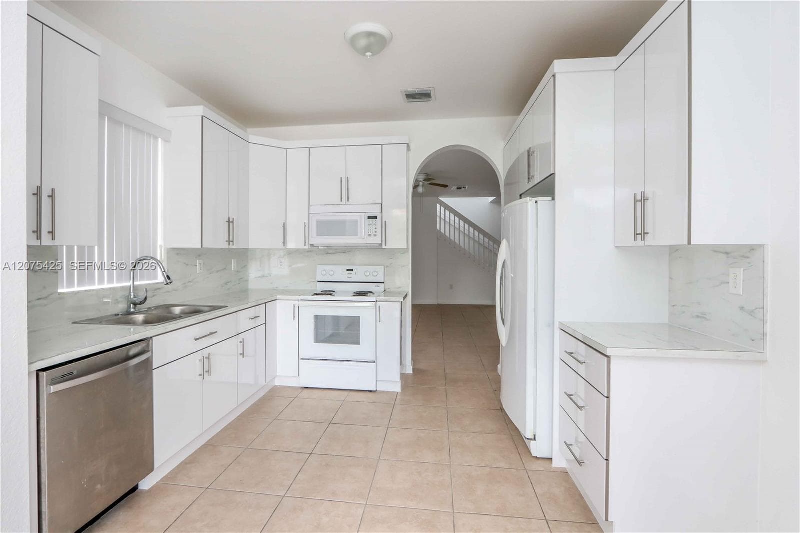 Alternate kitchen angle with white cabinetry.