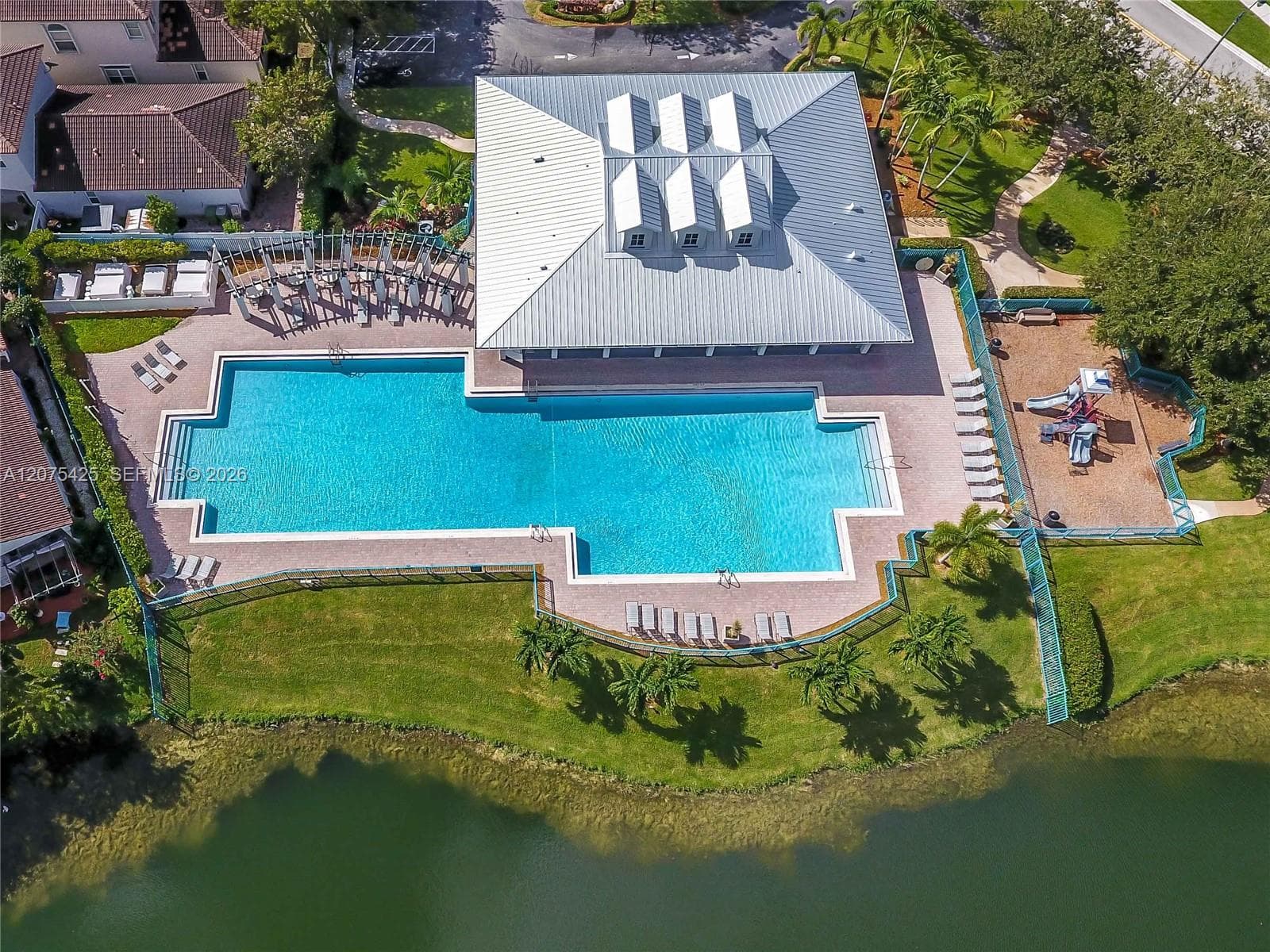 Community pool and recreational amenities view.