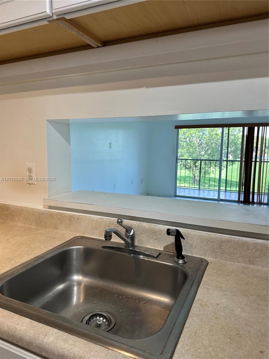 sink with view of balcony