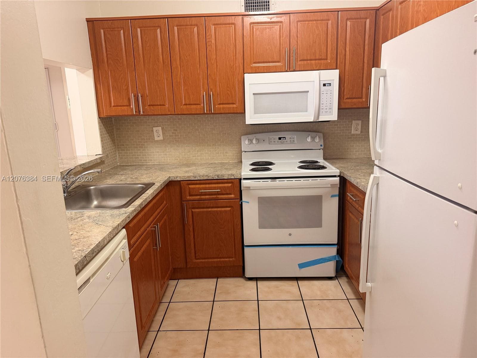 Complete Kitchen: Dishwasher, stove, oven, microwave and refrigerator.