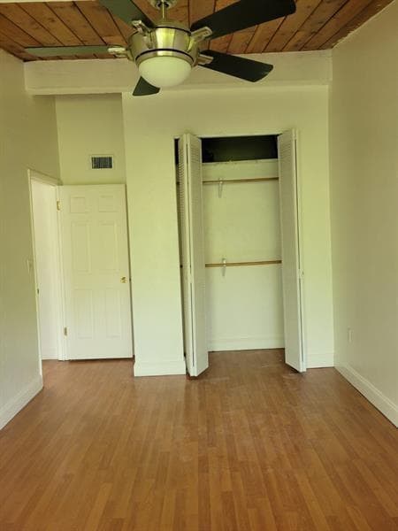 Other side of corner bedroom by bathroom