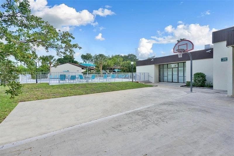 Back of clubhouse has basketball hoop