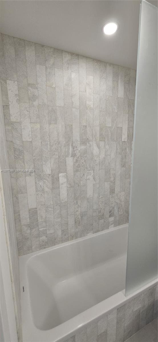 Bathroom #2 features a tub/shower and is en suite to guest bedroom.