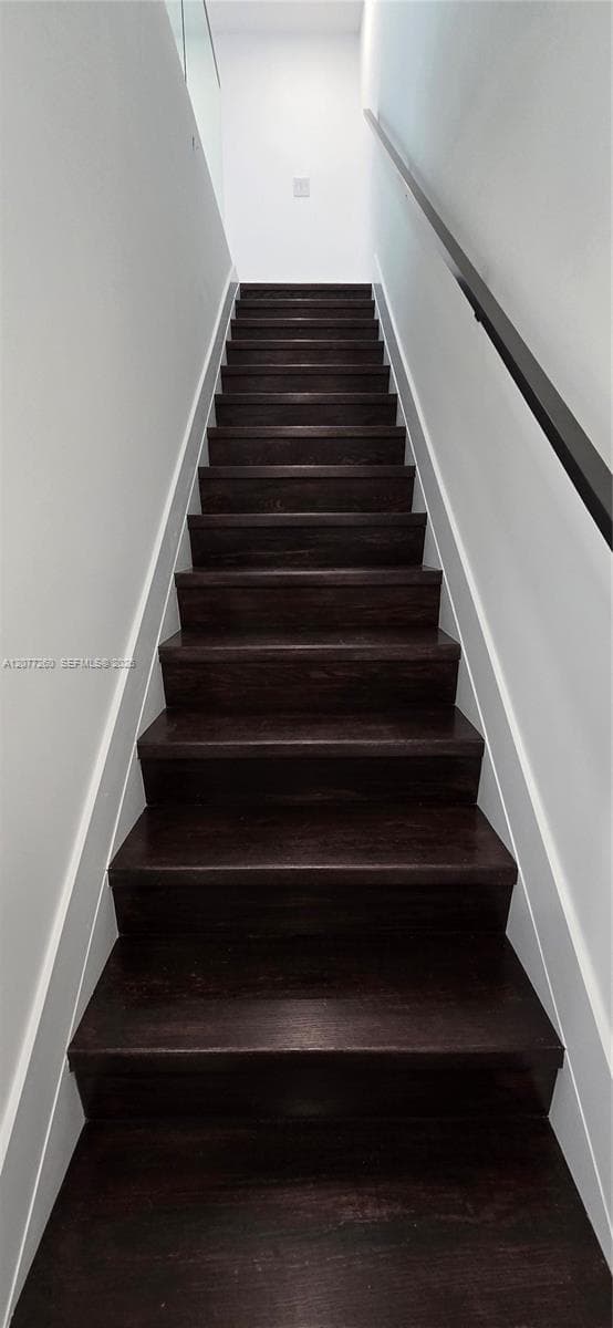 Stairway to bedrooms, bathrooms and laundry on the second floor.