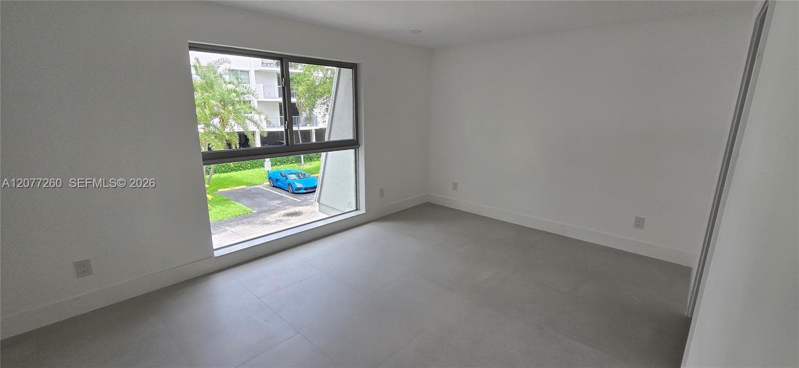 Bedroom #2 en suite. Featuring full length, wide window maximizing the light.