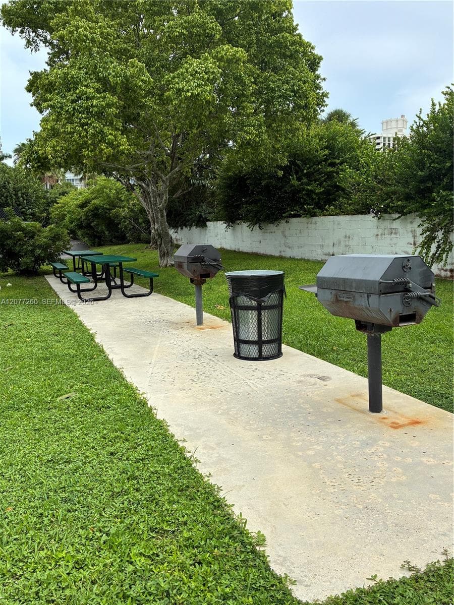Cape Florida Club's grill and picnic table area.