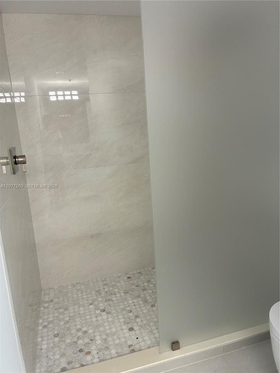Contemporary glass panel shower. All new. Be the first to reside in this residence.