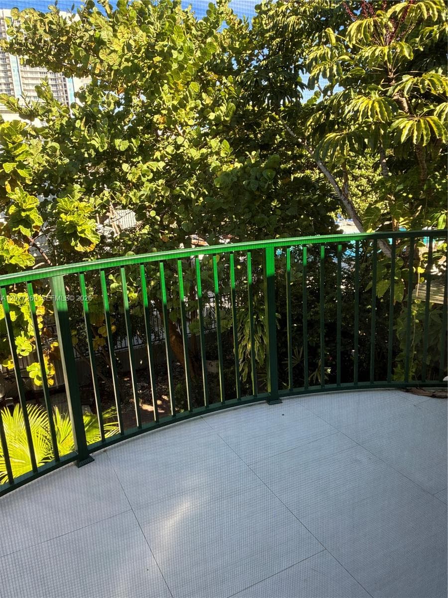 Private balcony from the primary bedroom. Catch up on the morning news and breathe the fresh air.  Plan your day in the quiet of the morning among flora & foliage.