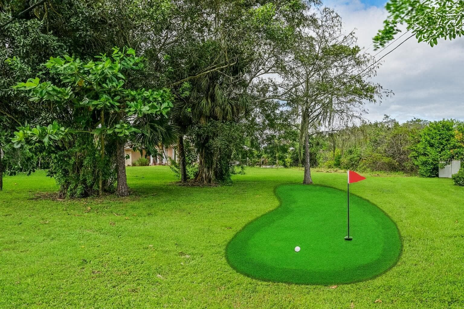 Lush Backyard with Putting Green