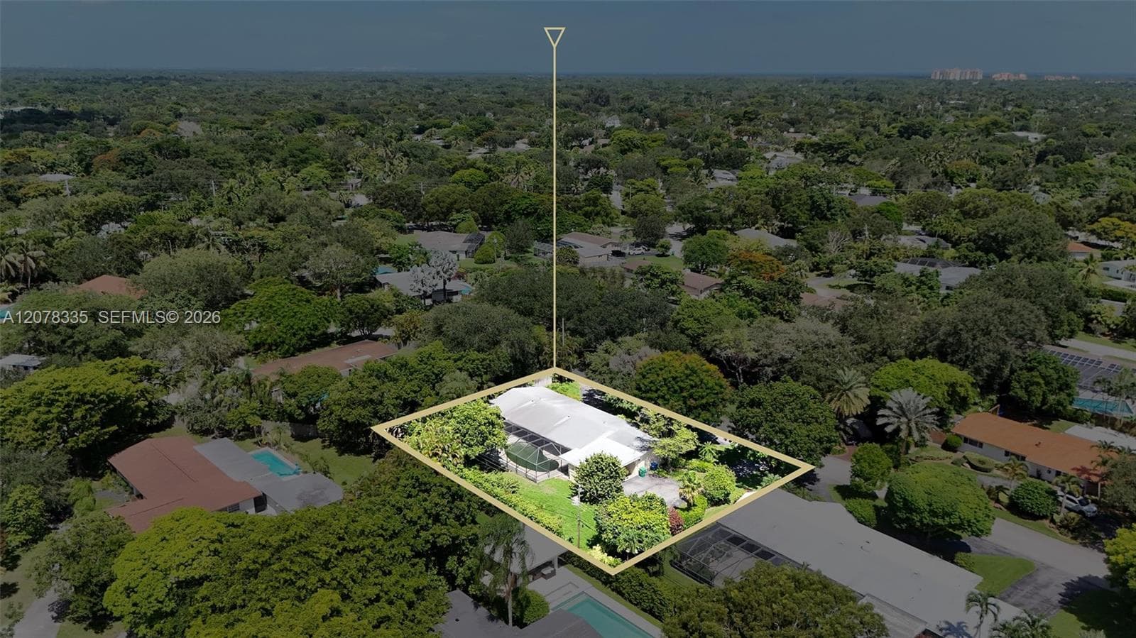 Aerial perspective of the estate showing its generous lot size and tree-lined surroundings.