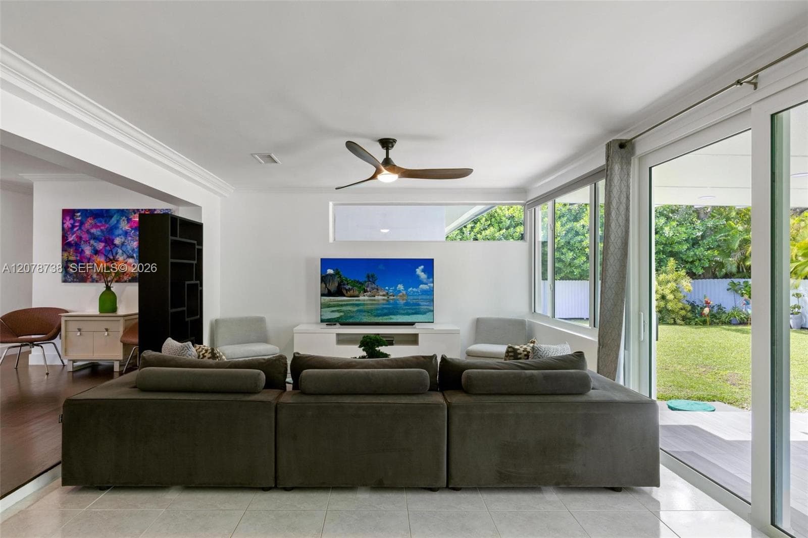 the connection to the backyard makes even the practical spaces feel open and inviting.
