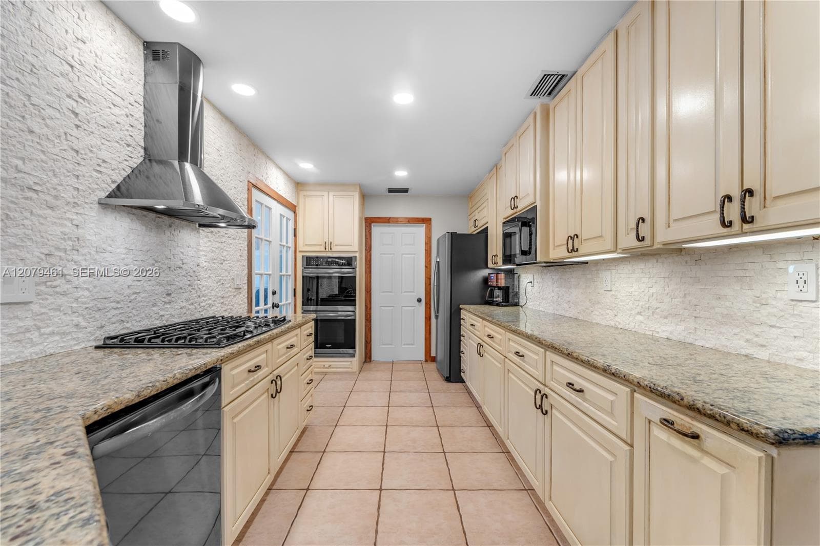 REMODELED CHEF'S KITCHEN WITH GAS STOVE.