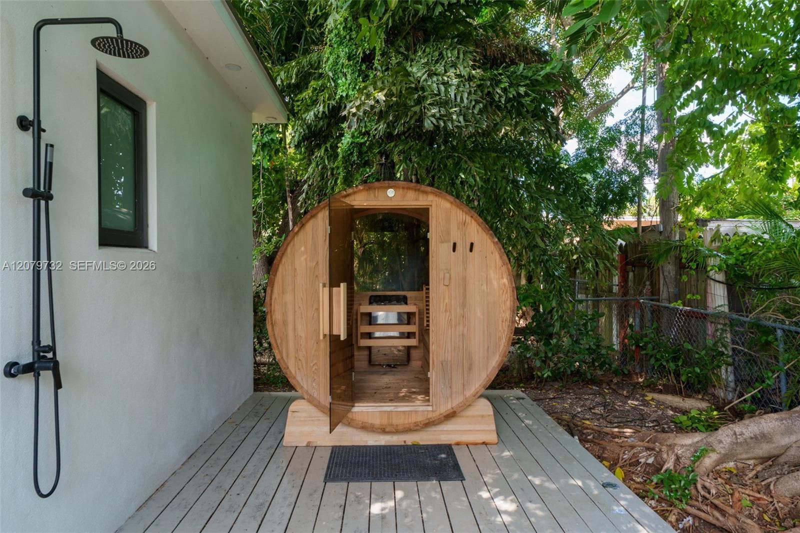 Sauna & outdoor shower on backyard deck by guest house