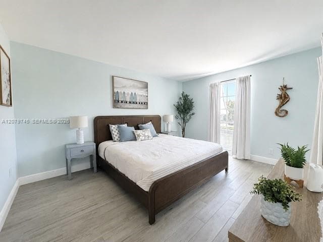 Spacious primary bedroom with view of water!