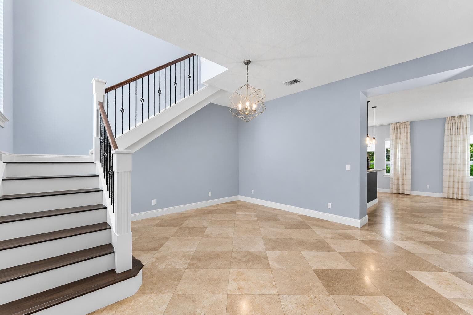 Airy Modern Foyer with Geometric Chandel