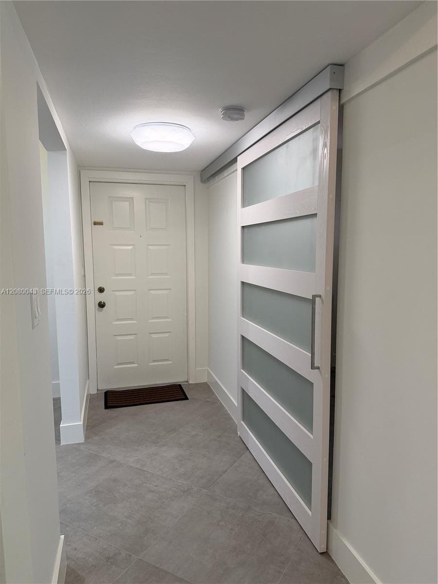 Barn door opening to bedroom/office/yoga studio.