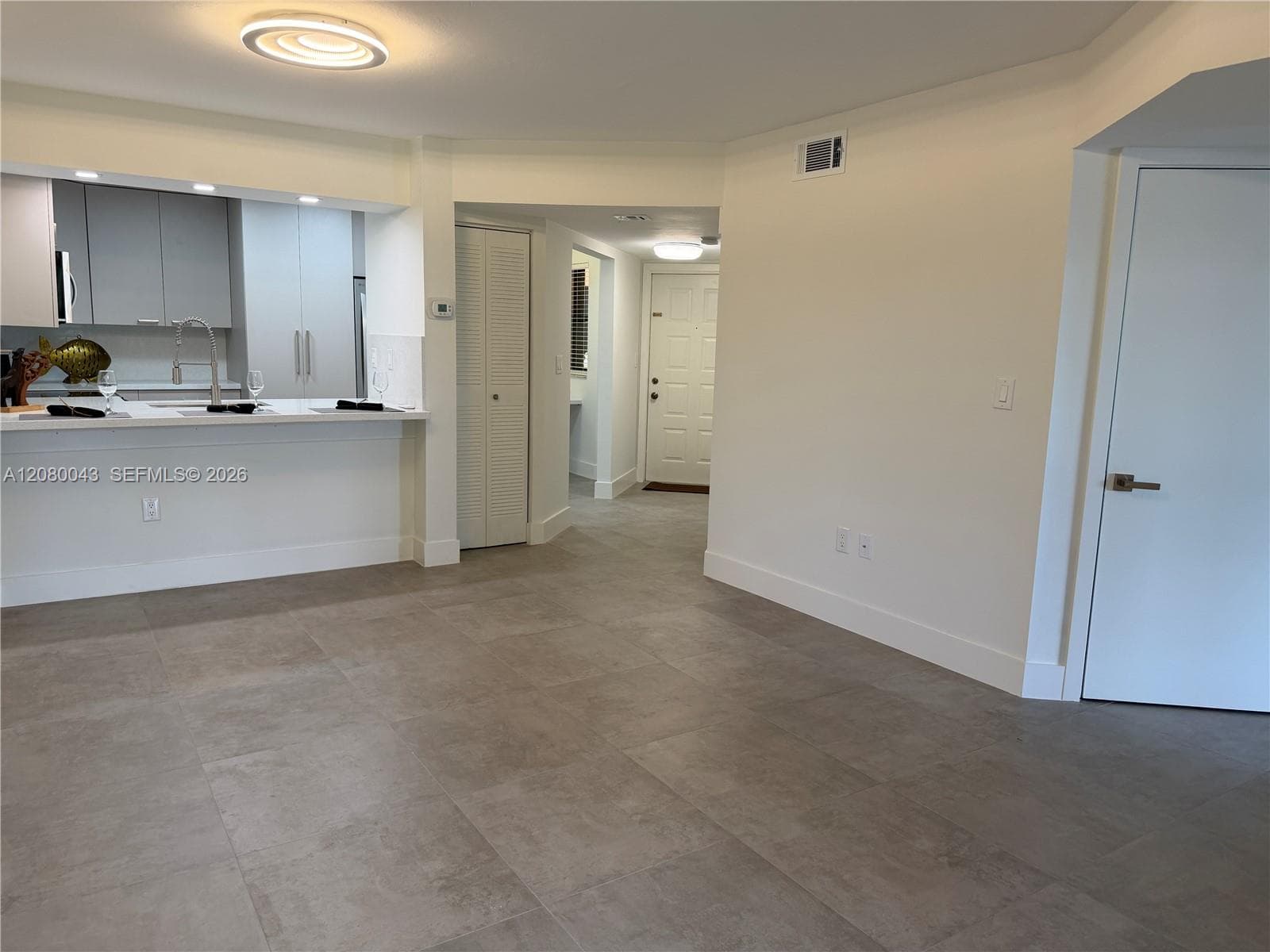 Porcelain "concrete" look tile throughout