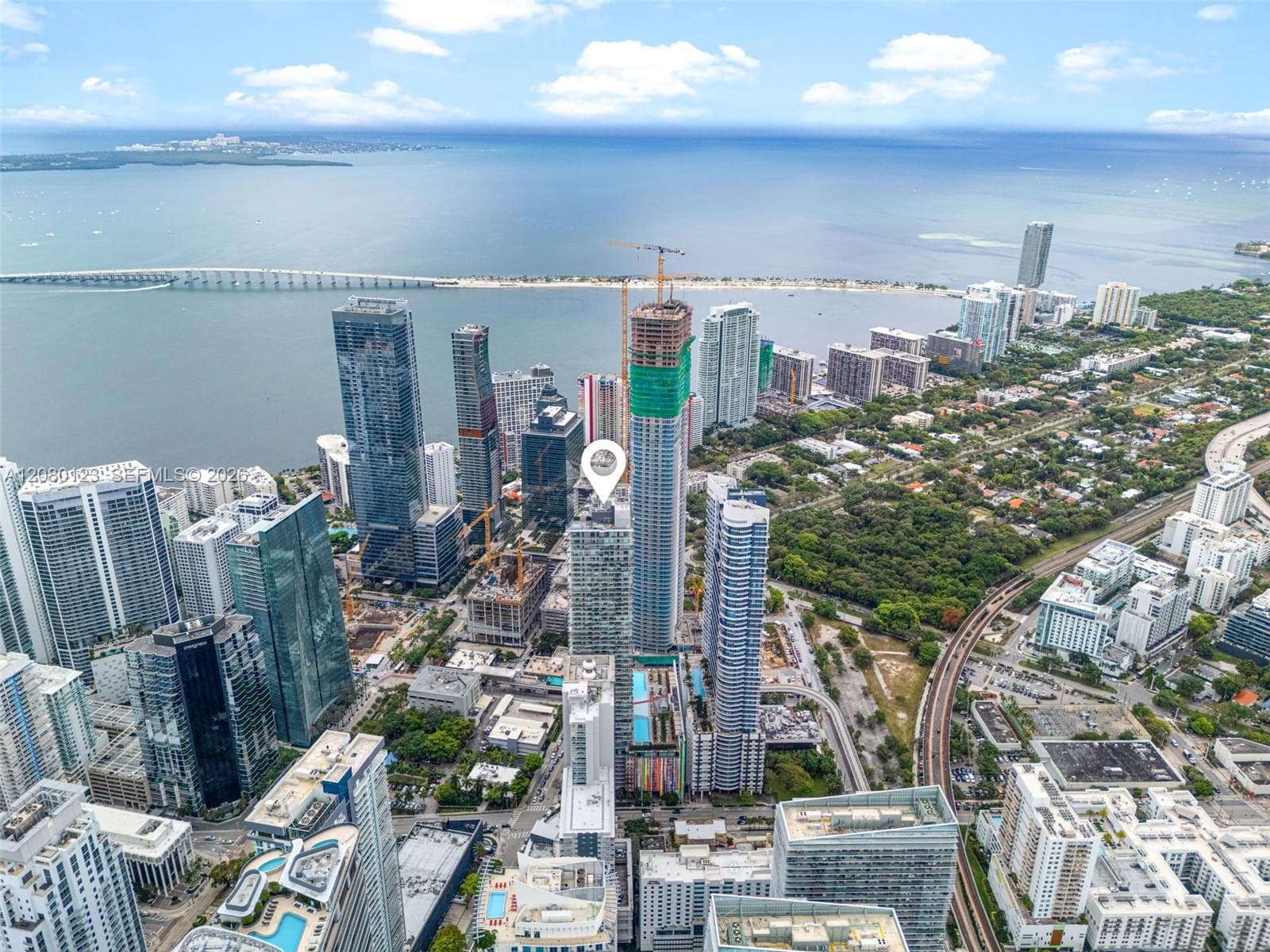 Aerial view of Brickell, Biscayne Bay, and Miami Beach from above SLS Brickell Dua.