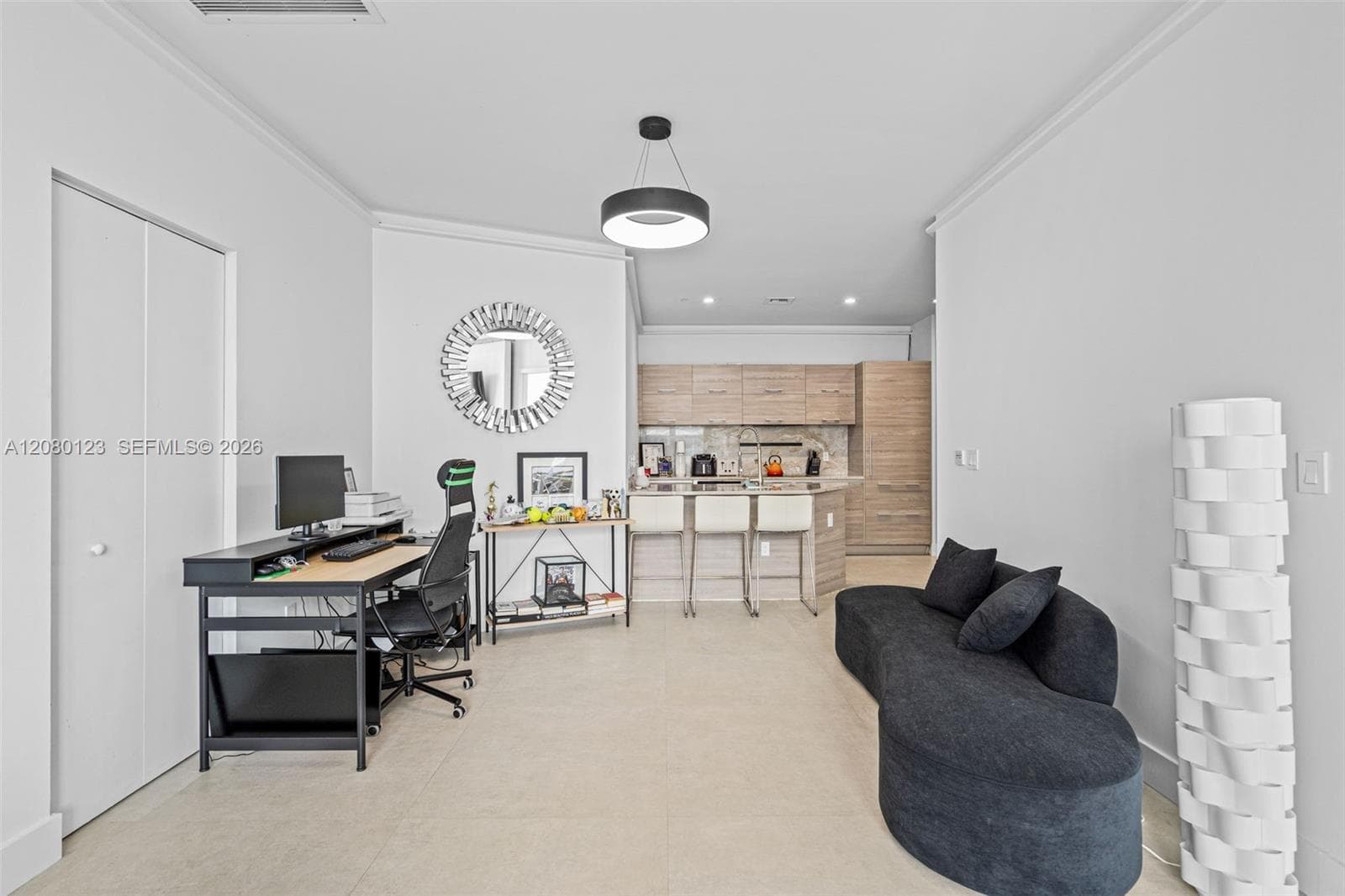 Open kitchen flowing into the dining area - perfect for entertaining at this 2-bedroom Brickell penthouse.