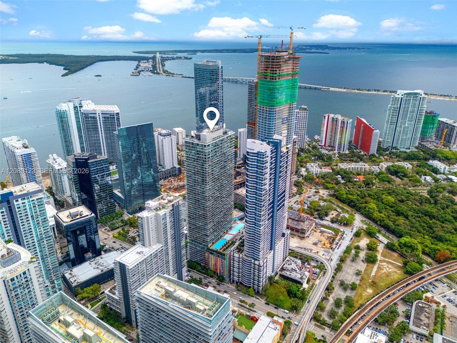 Aerial drone view highlighting SLS Brickell Dua tower against the Miami skyline.