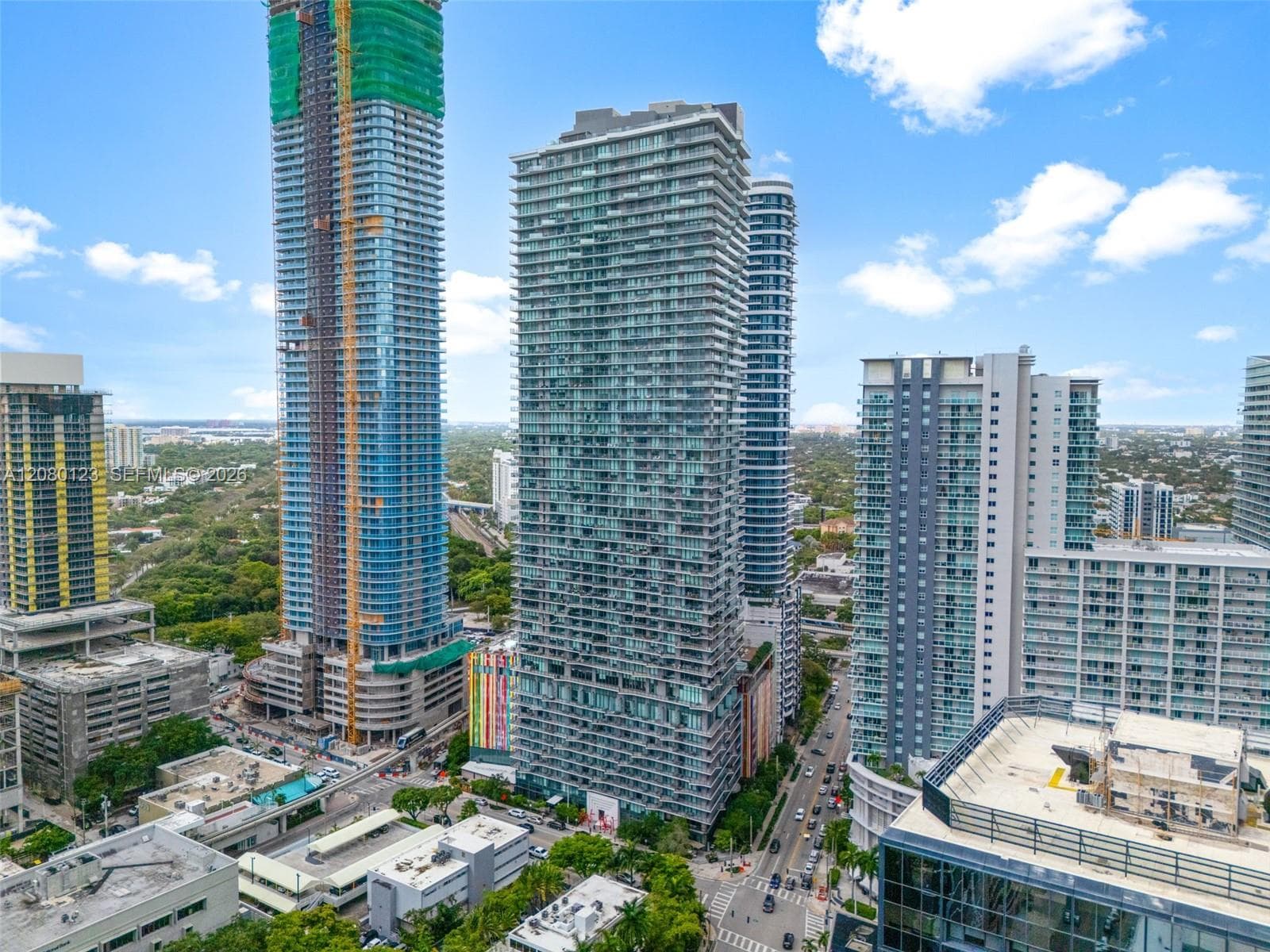 Aerial view of SLS Brickell Dua tower set against the Brickell skyline - PH-5209 occupies the 52nd floor.
