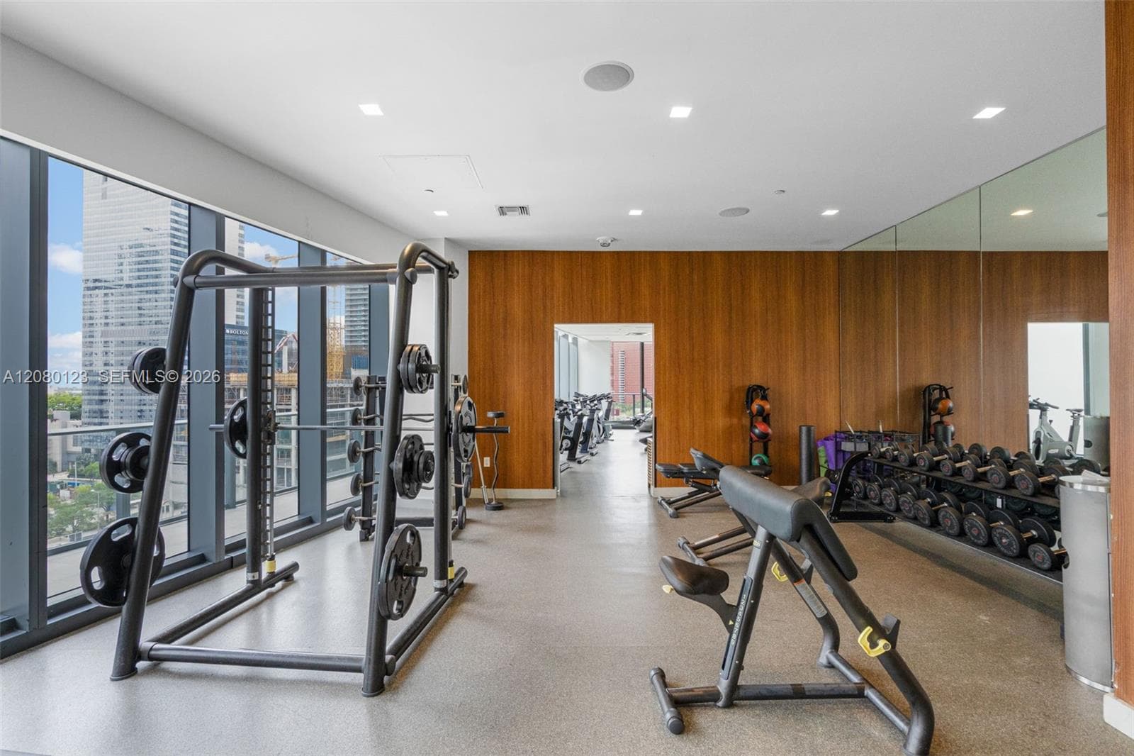 Fully equipped fitness center with Technogym free weights and resistance equipment.