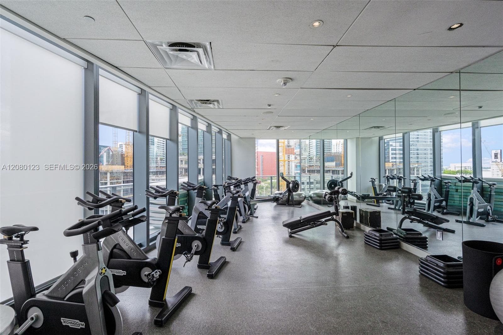 Spinning and cardio studio with Technogym bikes - boutique fitness inside the building.