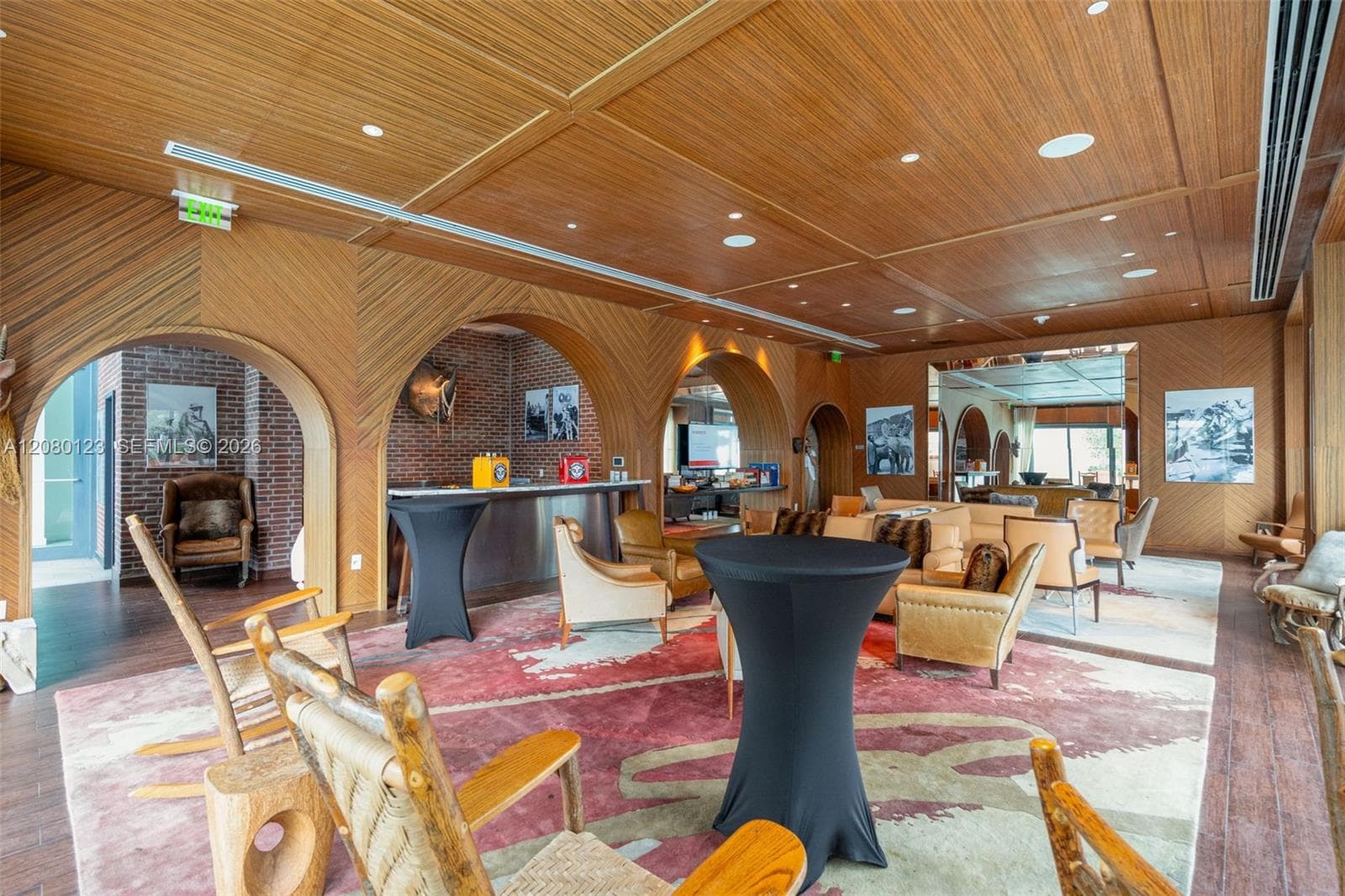 Signature SLS-branded resident lounge with Western-inspired design and full bar.