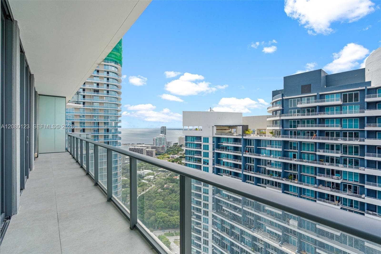 Private terrace with sweeping views of the Brickell skyline from the 52nd floor at SLS Brickell Dua.