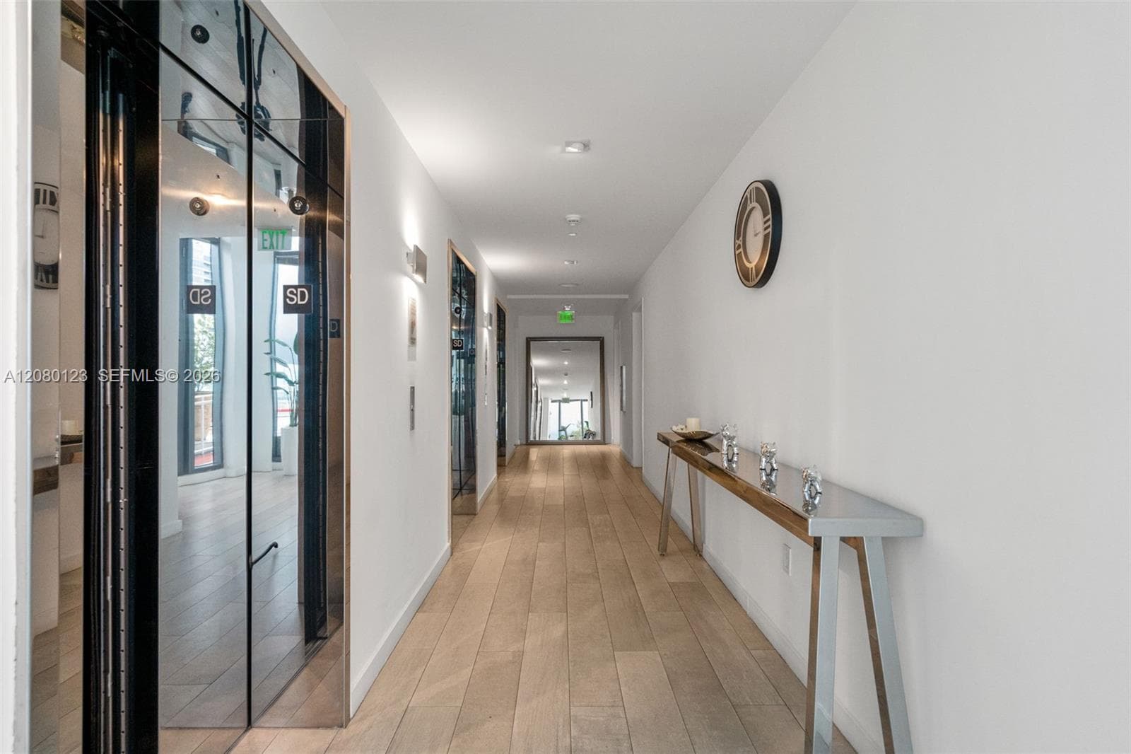 Polished resident hallway leading to private penthouse units at SLS Brickell Dua.