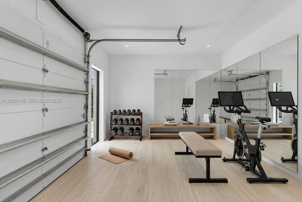 Garage/Gym. Disclaimer: Several photographs presented in this listing contain digitally added furniture, artwork, and decor. These virtually staged images are intended solely for illustrative purposes.