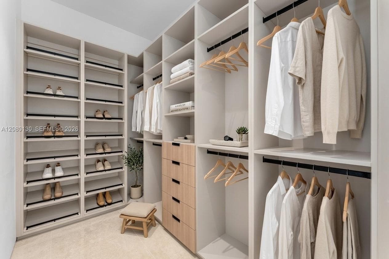 Guest Closet. Disclaimer: Several photographs presented in this listing contain digitally added furniture, artwork, and decor. These virtually staged images are intended solely for illustrative purposes.