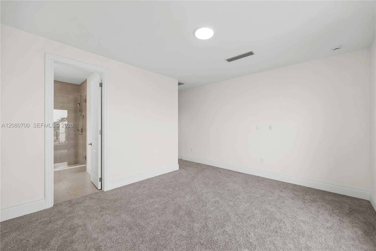 Neutral-toned wall paint with gray carpeting