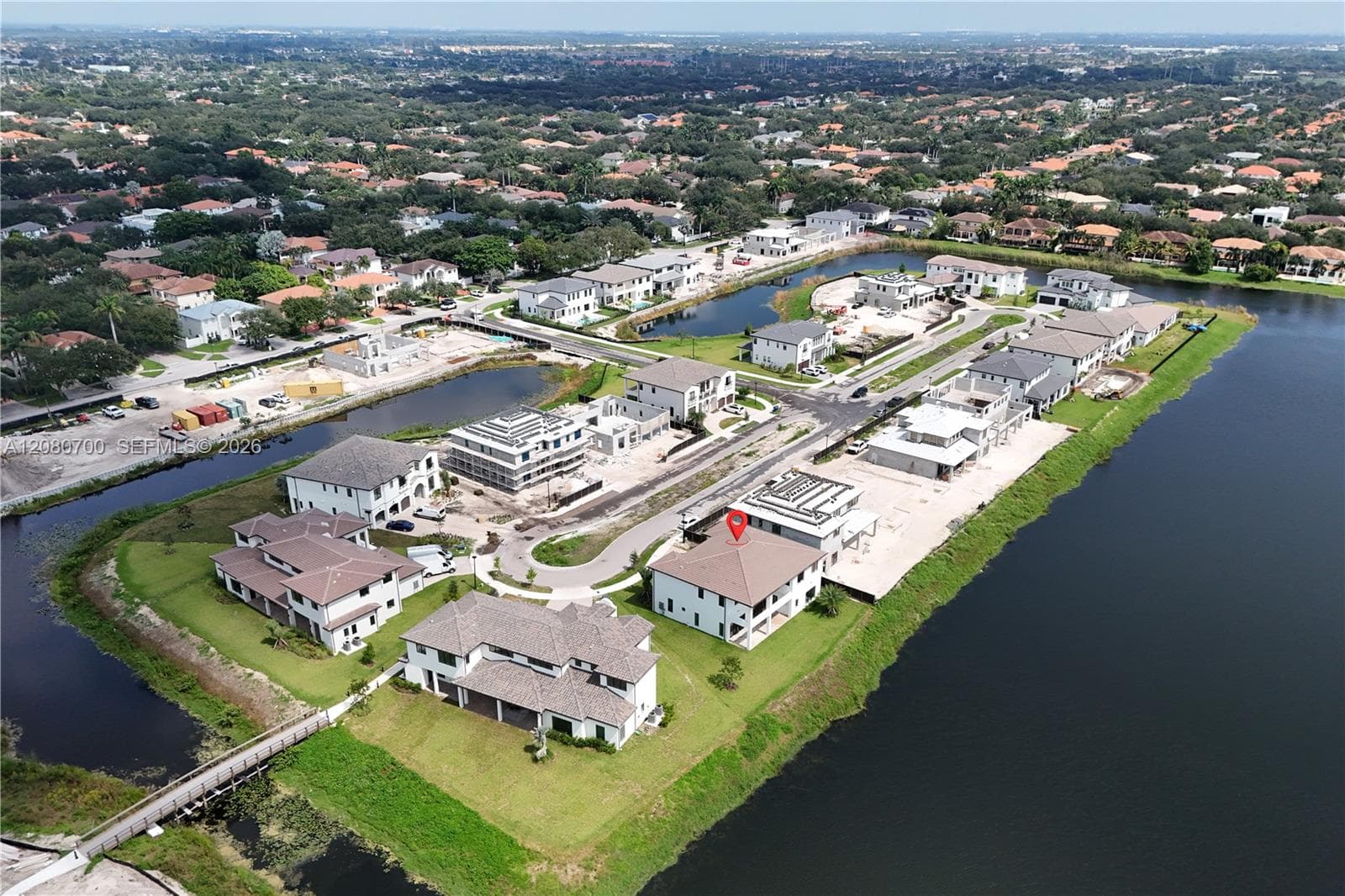 New construction homes on a waterway with tile roofs and private boat docks