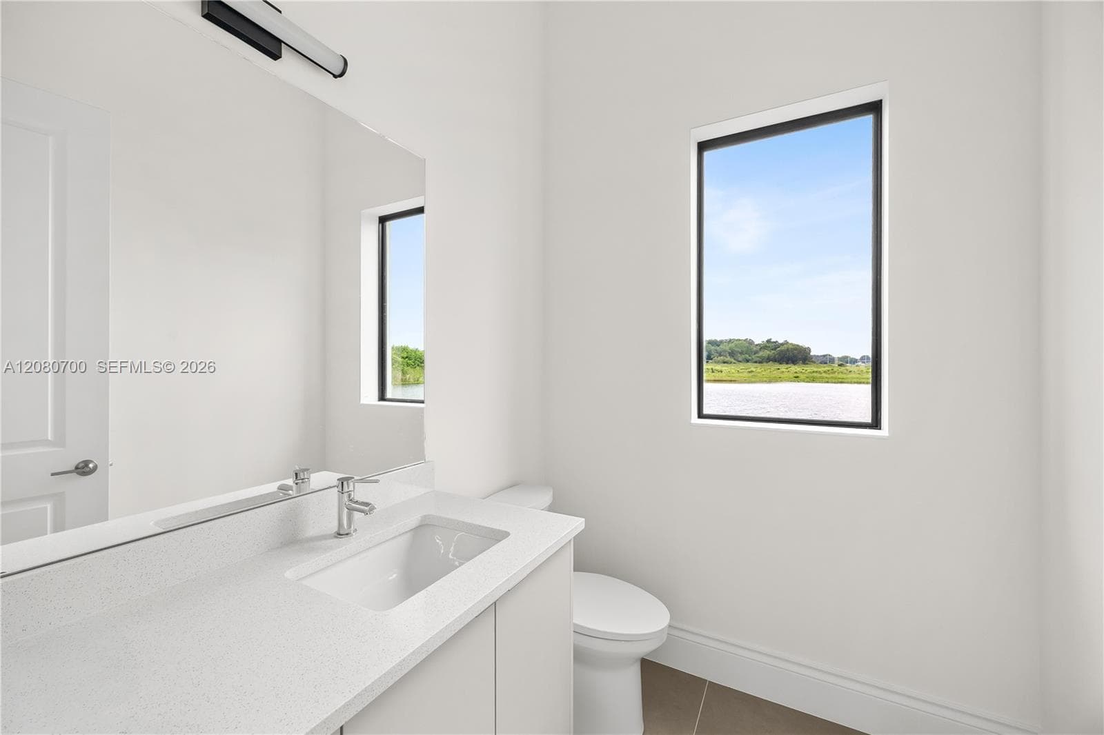 Modern vanity with an integrated sink and chrome faucet