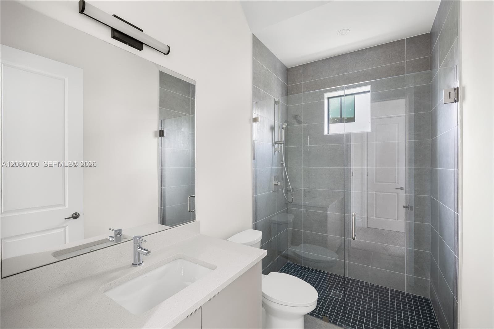 Large vanity mirror with integrated linear lighting