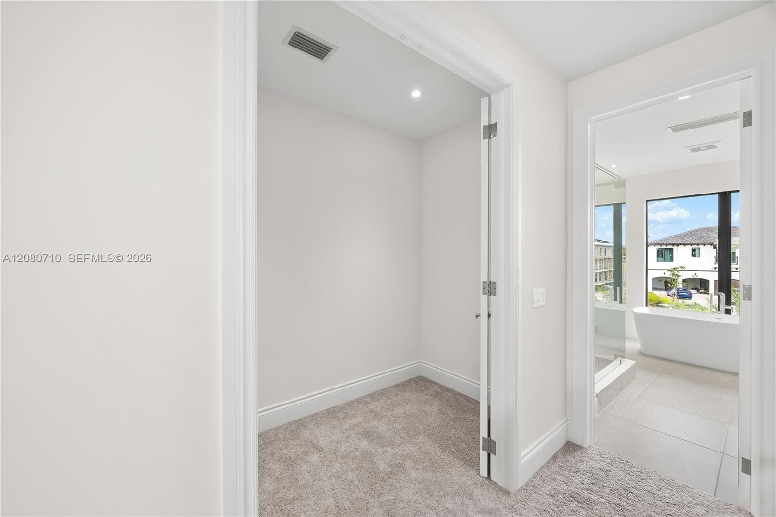 Carpeted storage area with recessed lighting