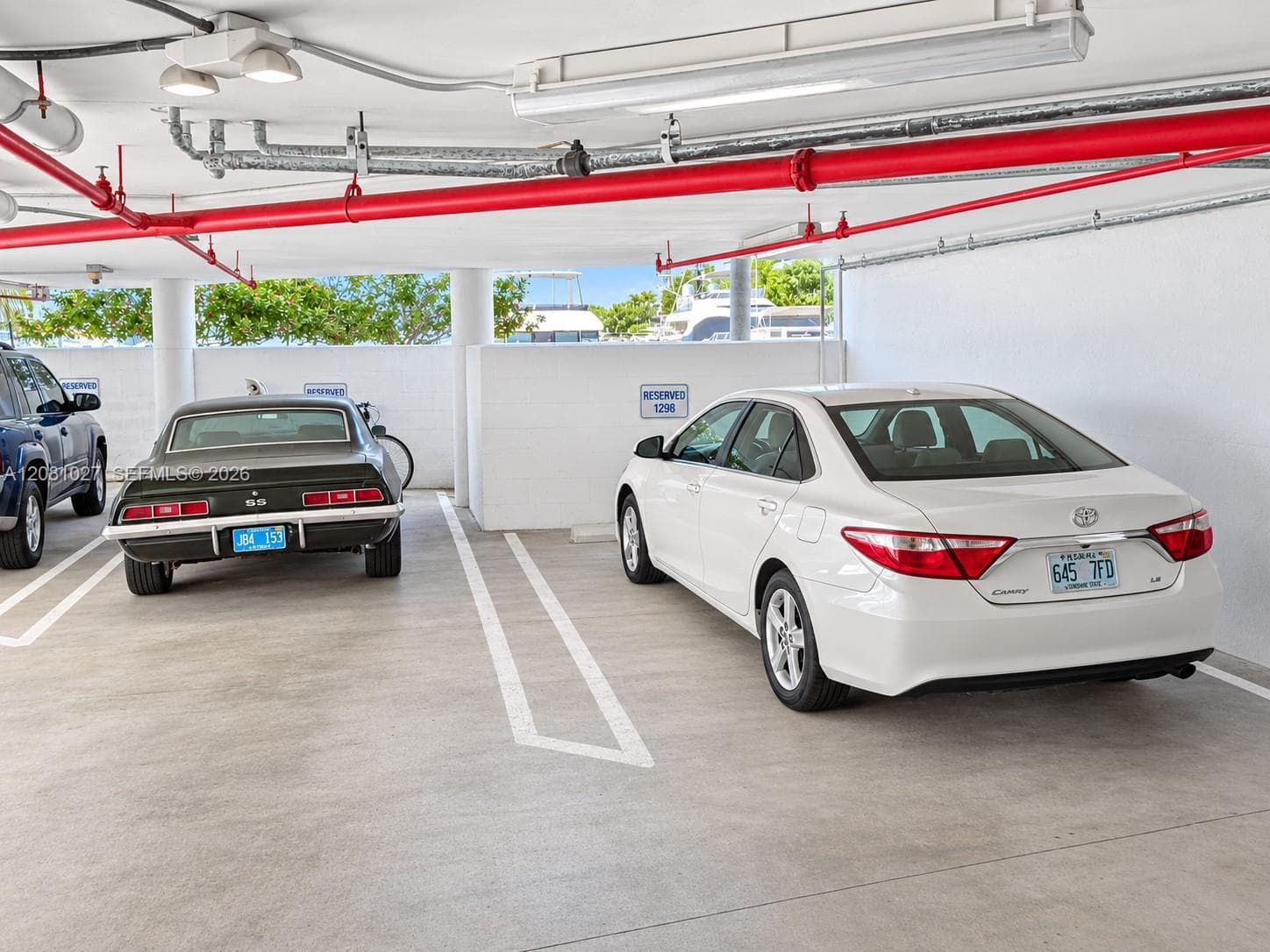 Assigned covered parking for unit, 2nd spot in front of unit entry
