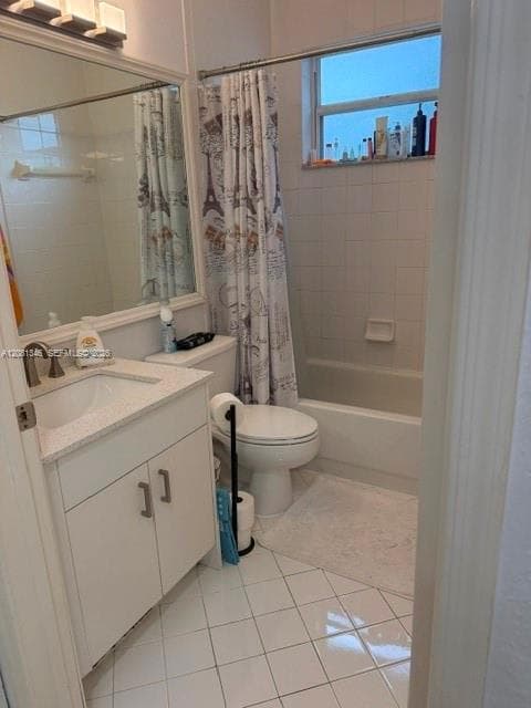 Bathroom featuring a built-in vanity with a white countertop, undermount sink, and white cabinetry