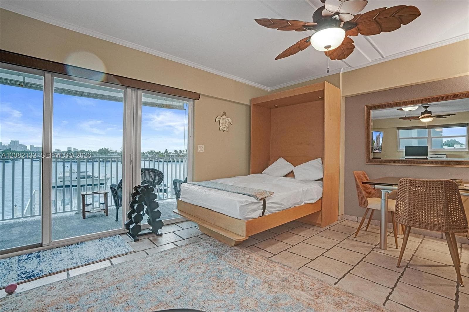 Living Room has convenient Murphy Bed for overnight guests (looks as if it has never been used)