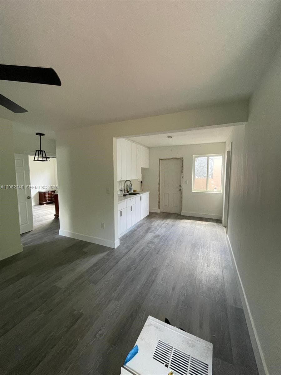 Entry way with view towards kitchen and bedrooms