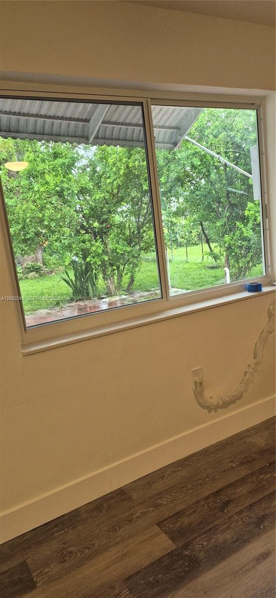 Dinning room with big window for natural light and view to fruit trees and privacy