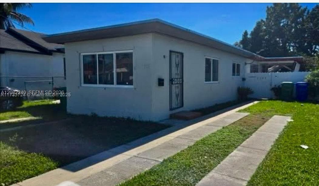 The unit is the back one behind the privacy fence with this parking spaces shown