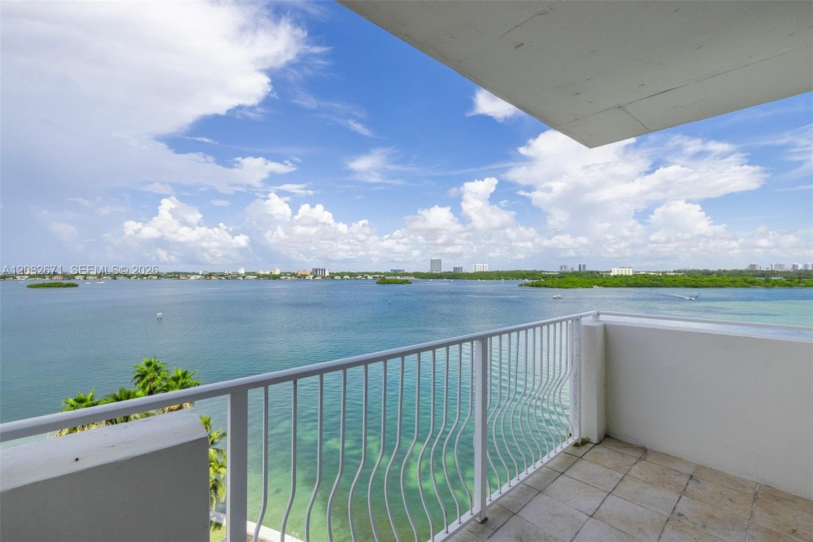 Private balcony with panoramic NW bay views.