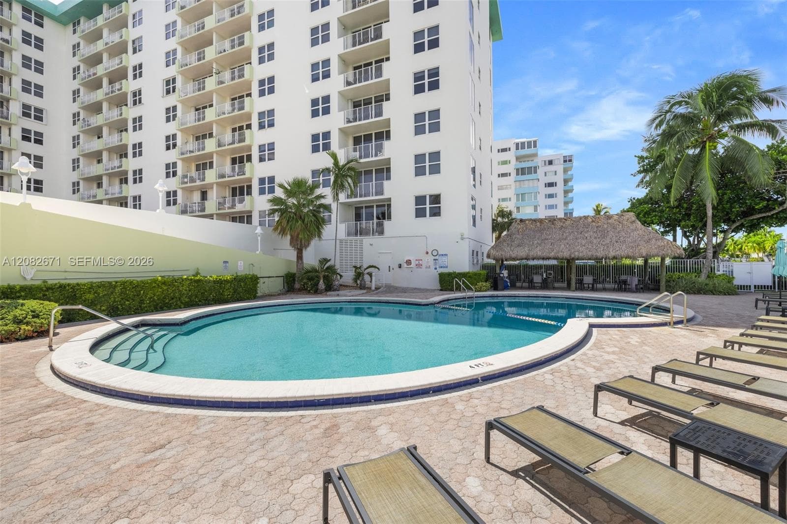 Second pool deck angle, palm-lined.
