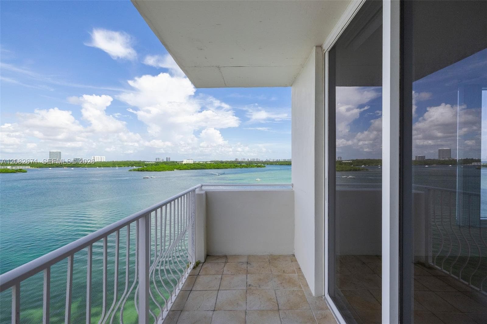 Balcony seating area overlooking the bay and skyline.