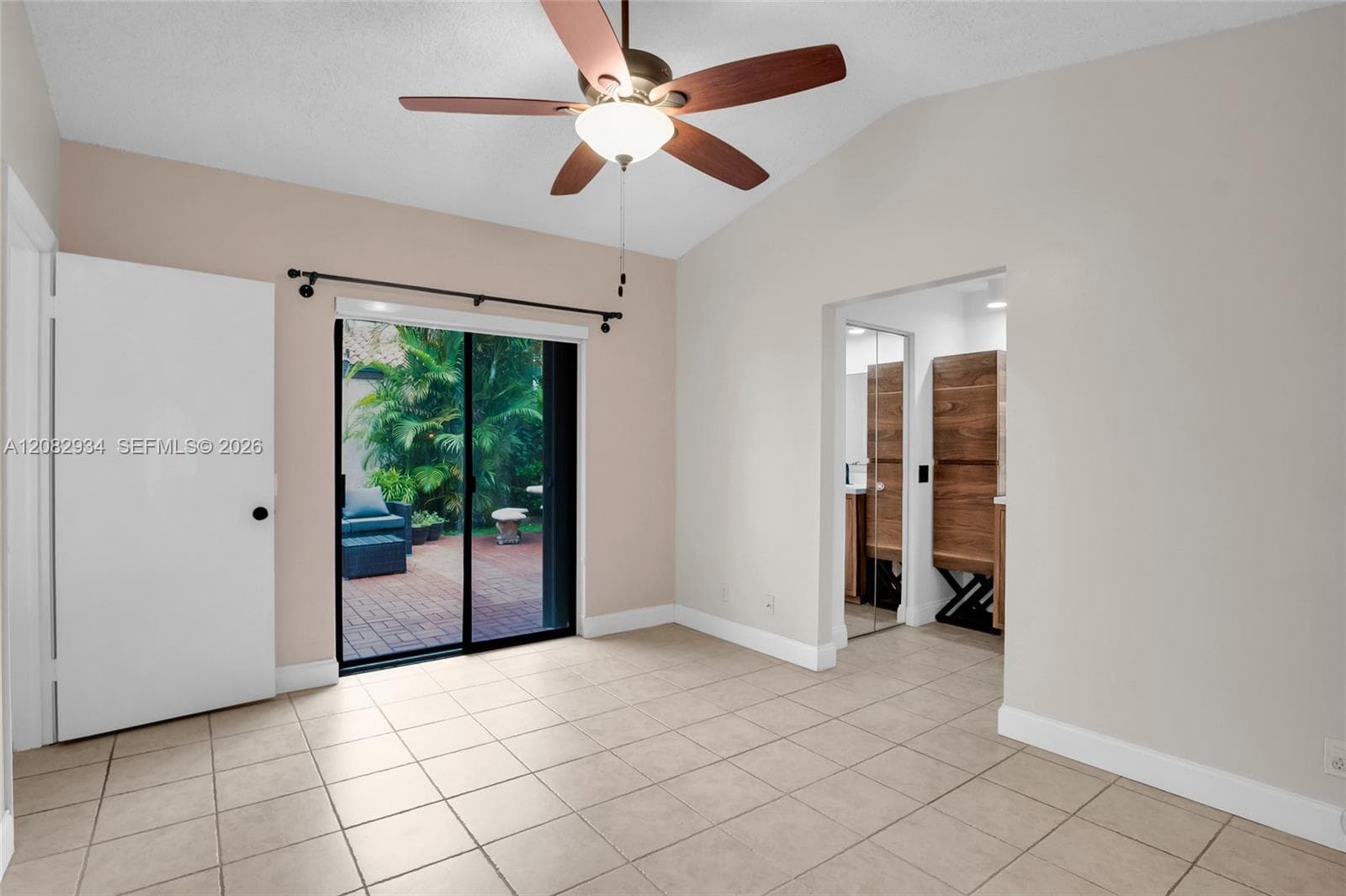 primary bdrm has sliding glass doors to outside area